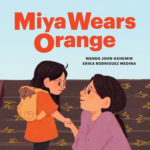 Miya wears orange book. Orange shirt day